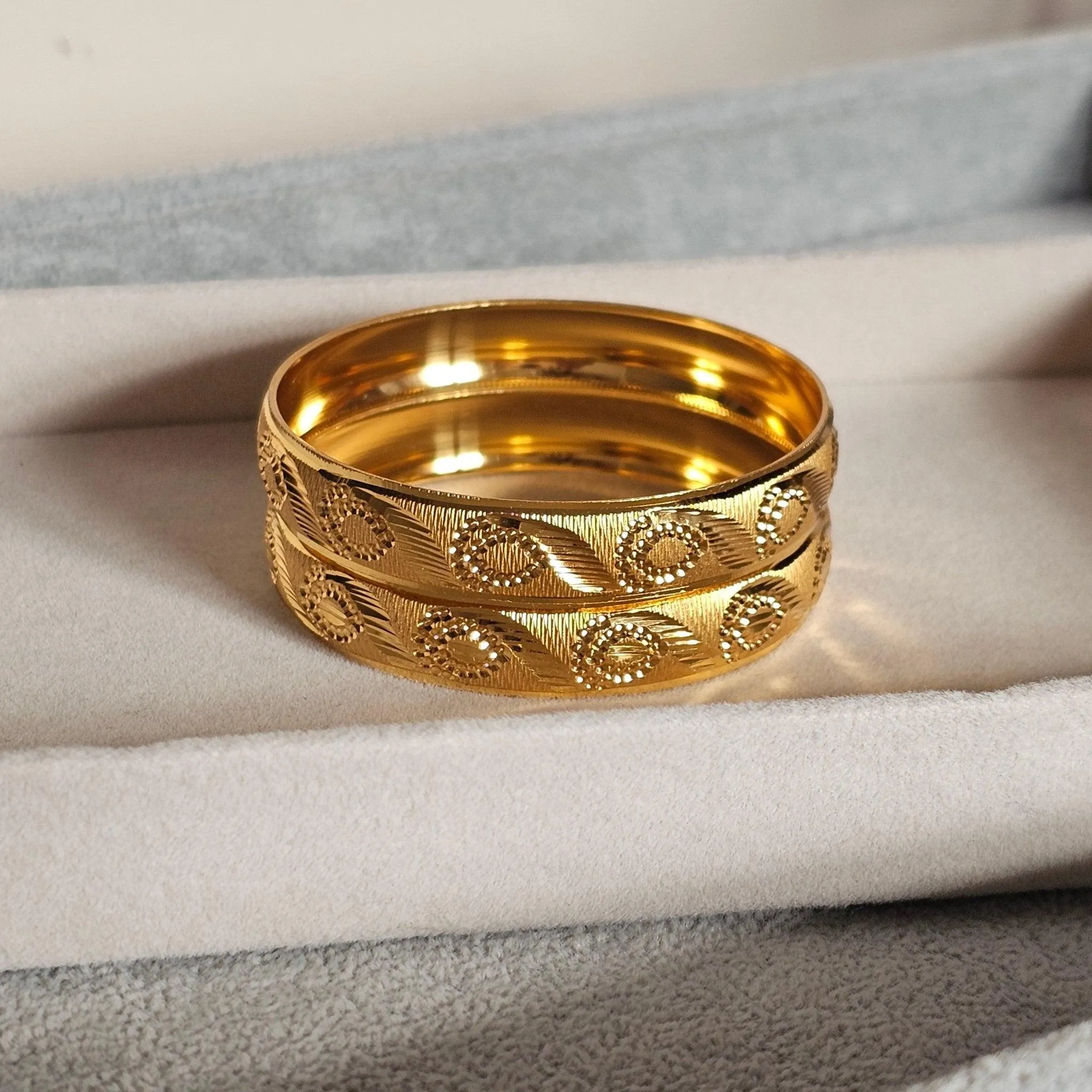 A Pair of Gold Plated Indian Bangles