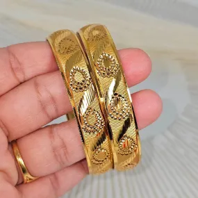 A Pair of Gold Plated Indian Bangles