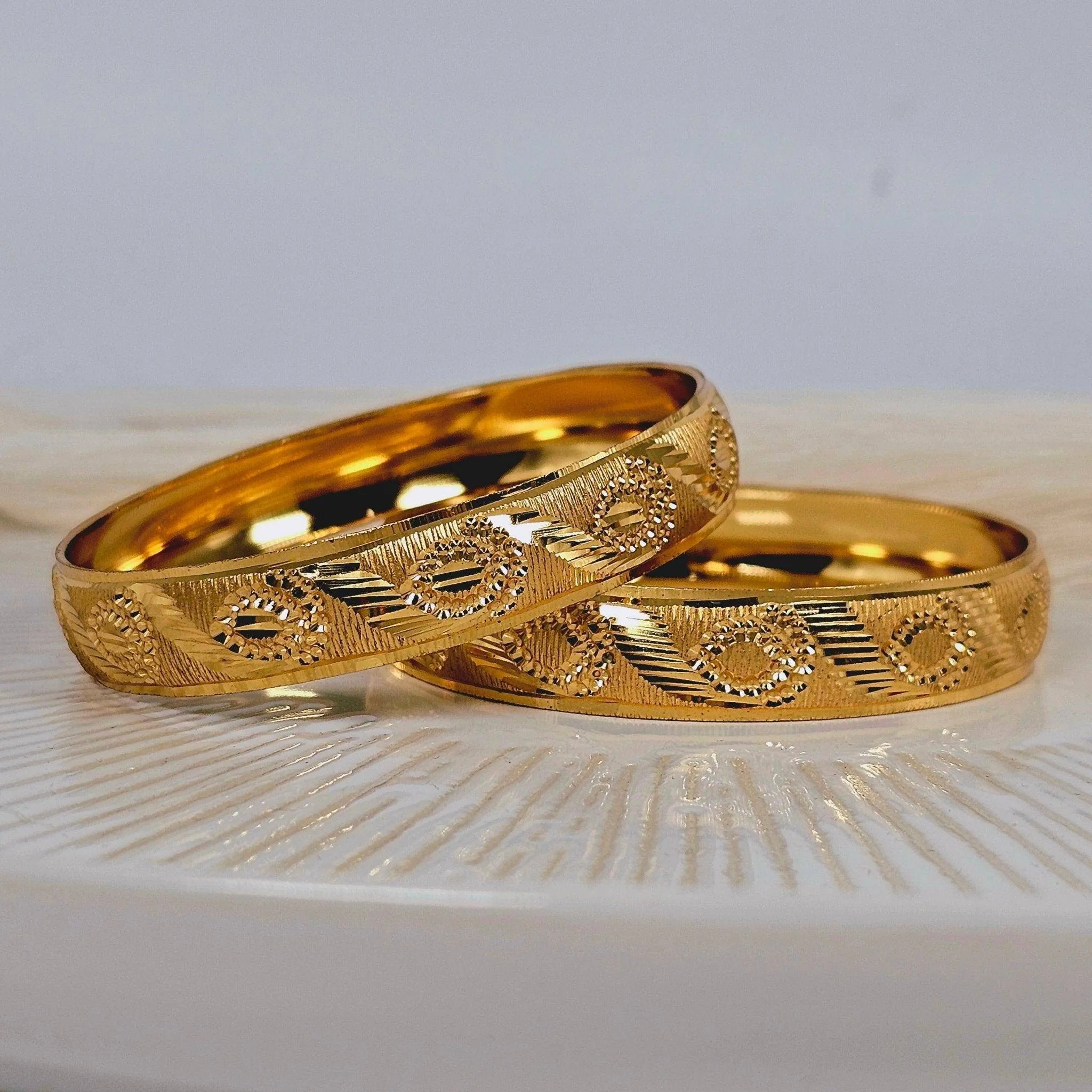 A Pair of Gold Plated Indian Bangles