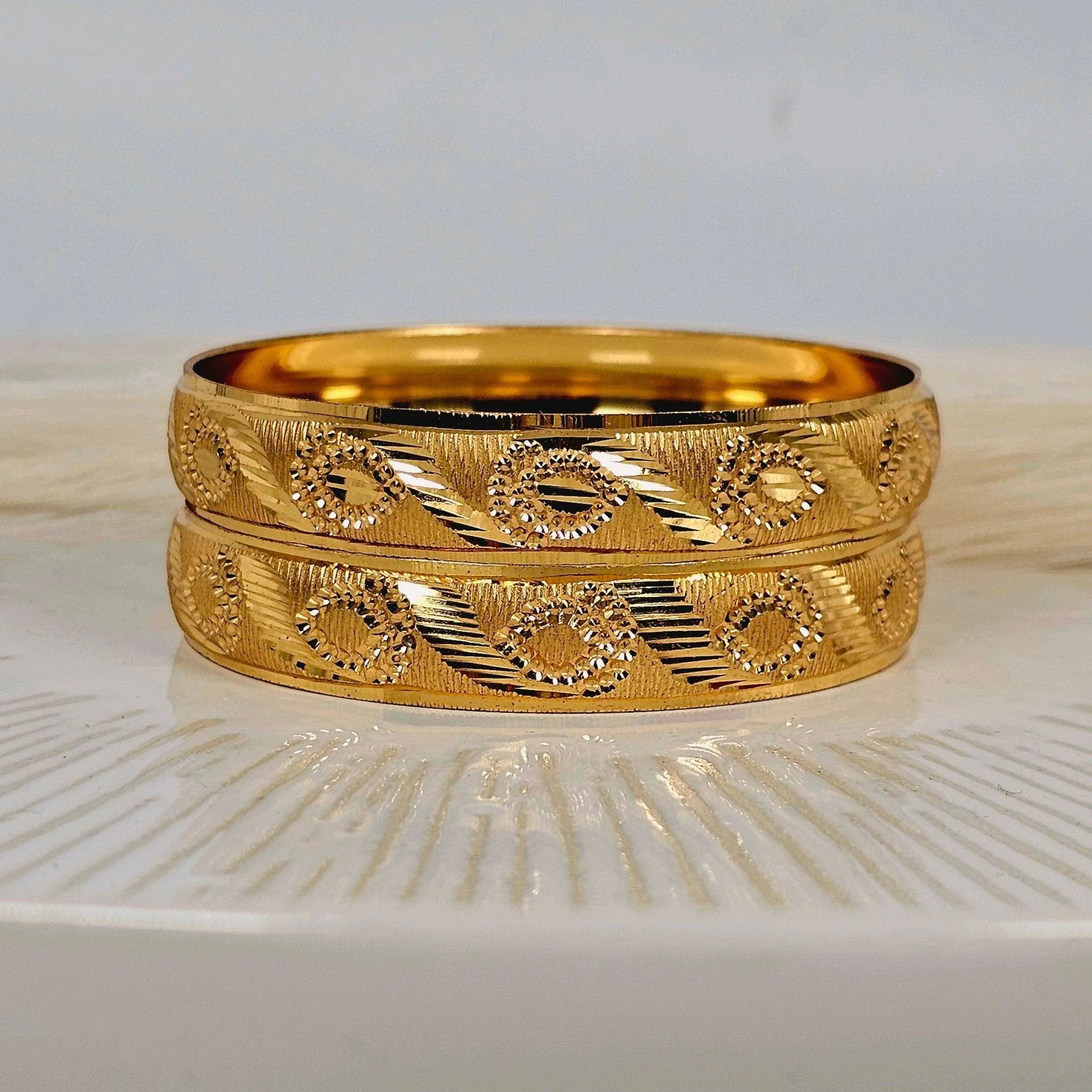 A Pair of Gold Plated Indian Bangles