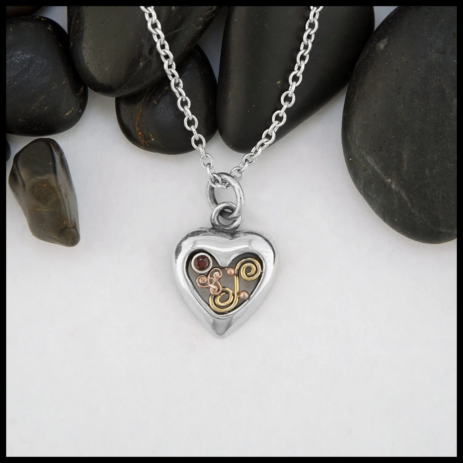 Dainty Triskele Heart Pendant with Garnet