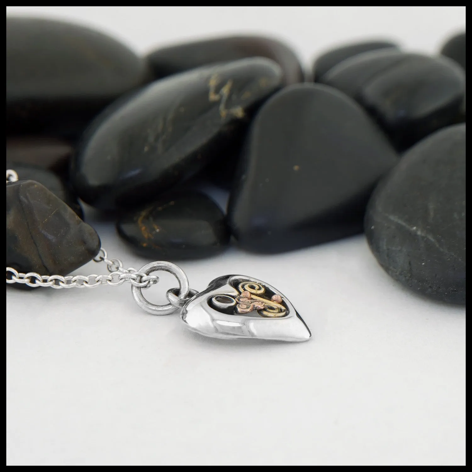 Dainty Triskele Heart Pendant with Garnet