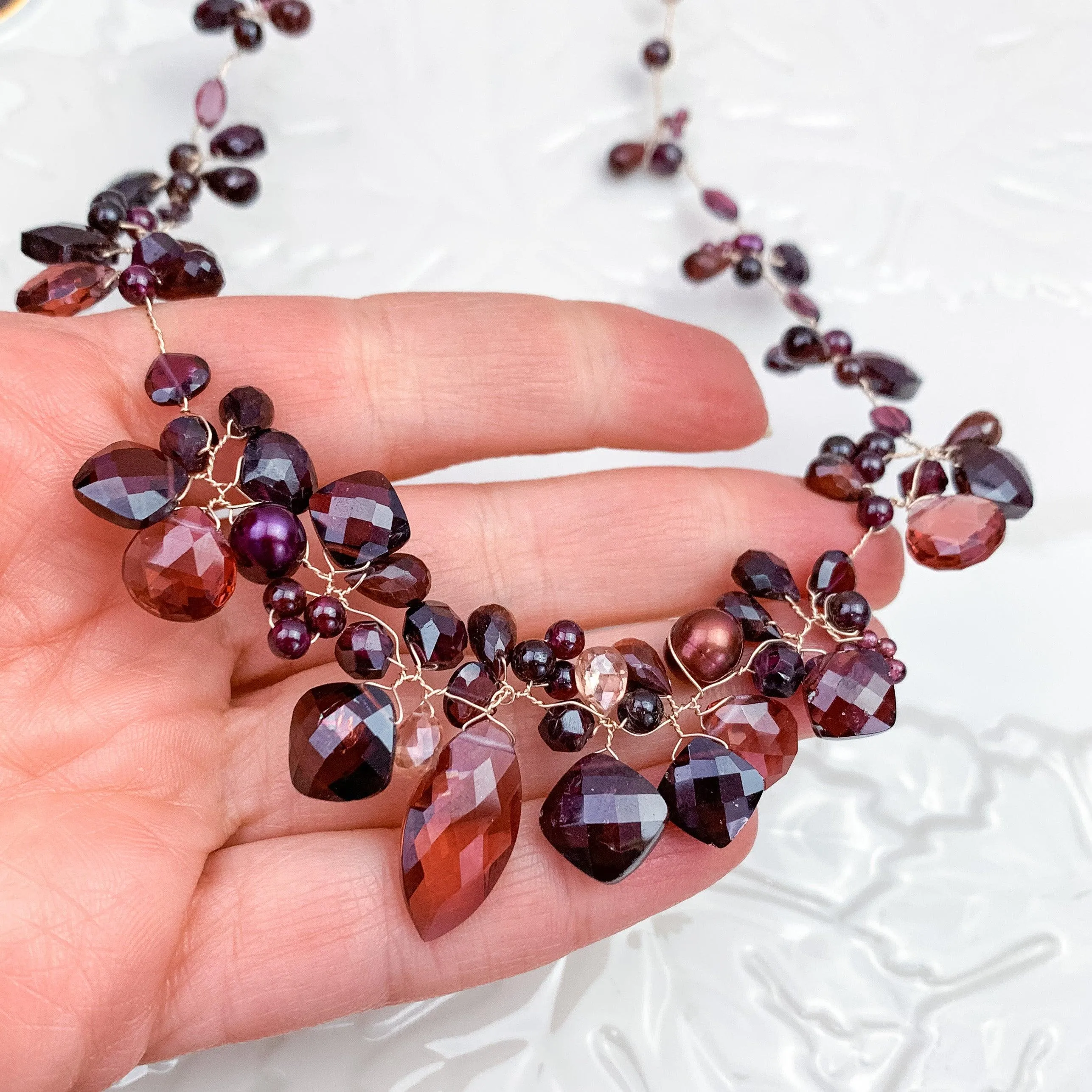 Enchanted Vine Garnet Necklace: A Symbol of Vitality and Elegance