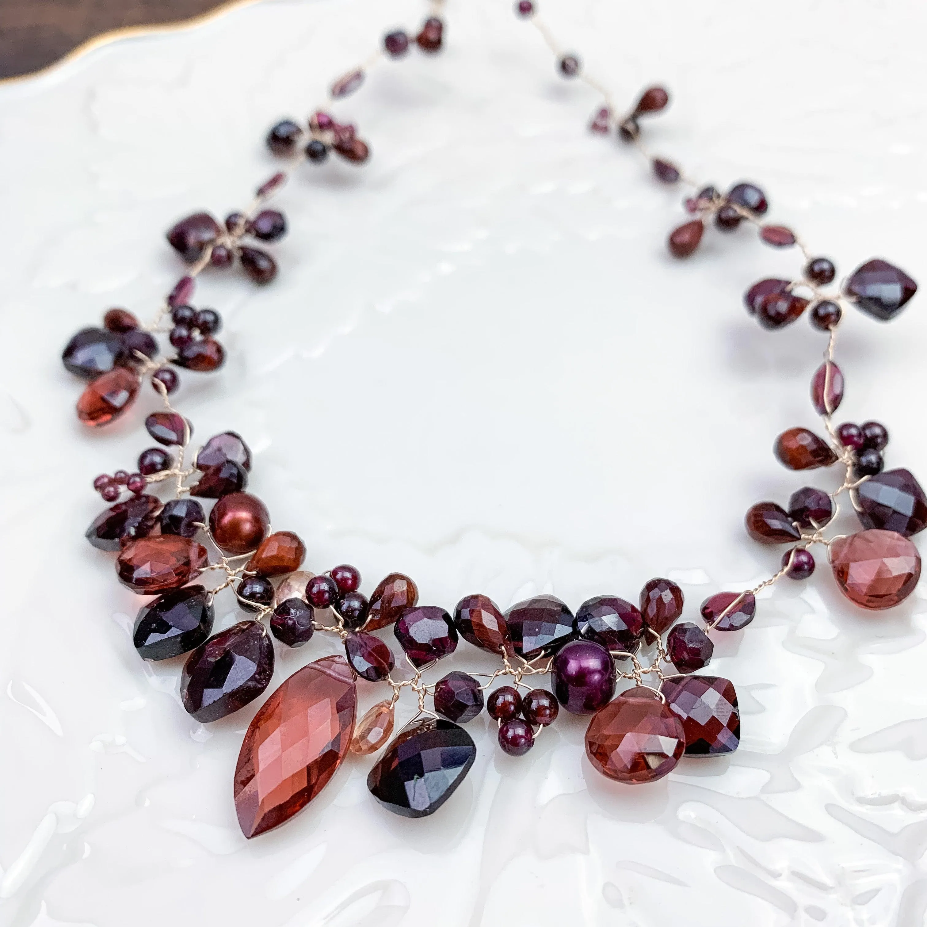 Enchanted Vine Garnet Necklace: A Symbol of Vitality and Elegance