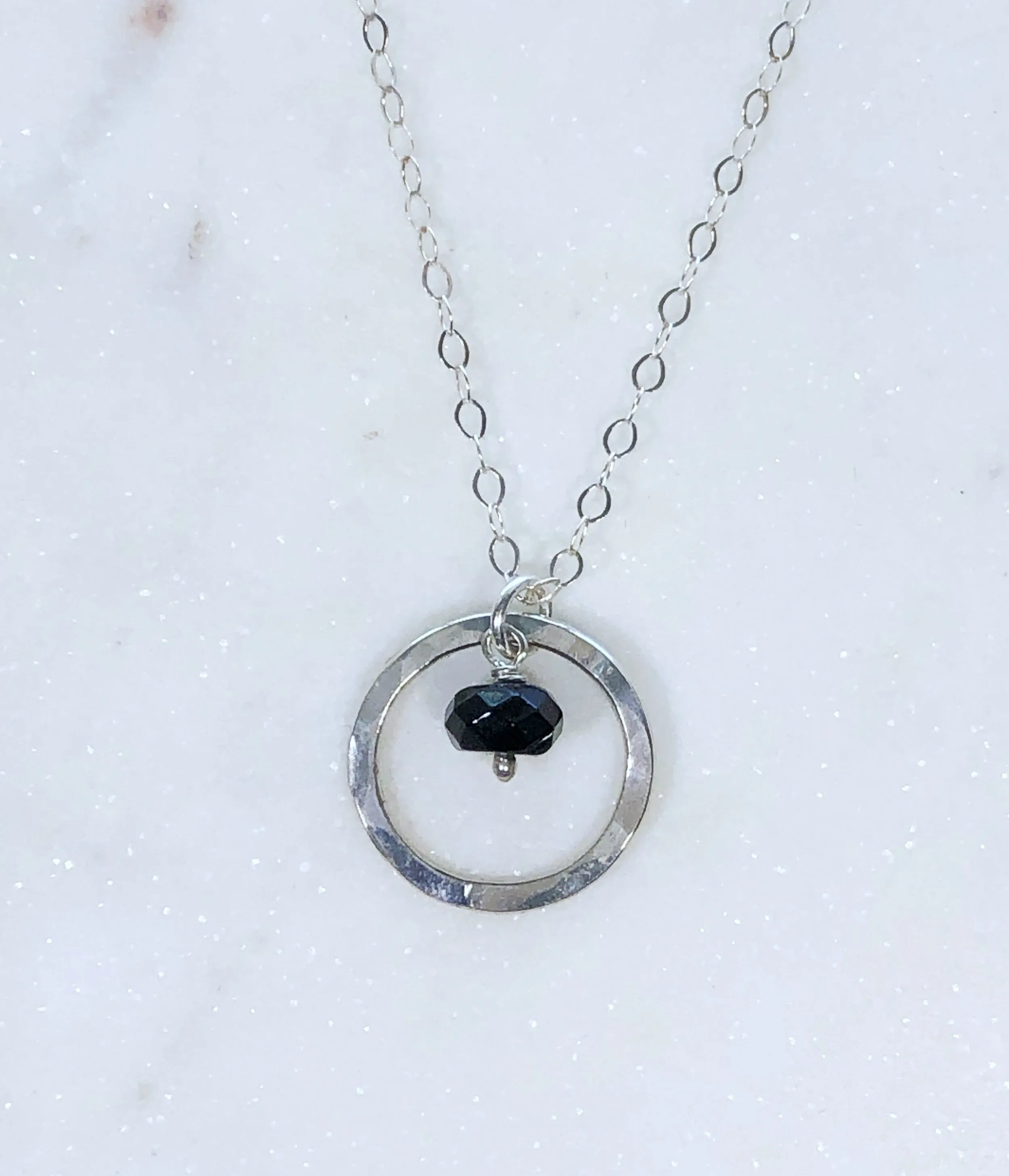 Sterling silver forged circle necklace with onyx gemstone